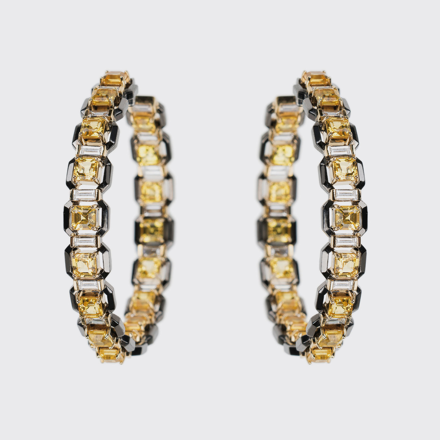 Yellow and black gold hoop earrings with yellow sapphires and white diamonds