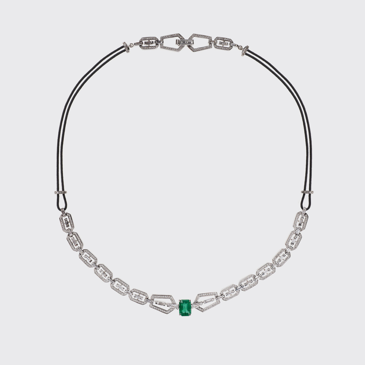 White gold necklace with white diamonds and emerald