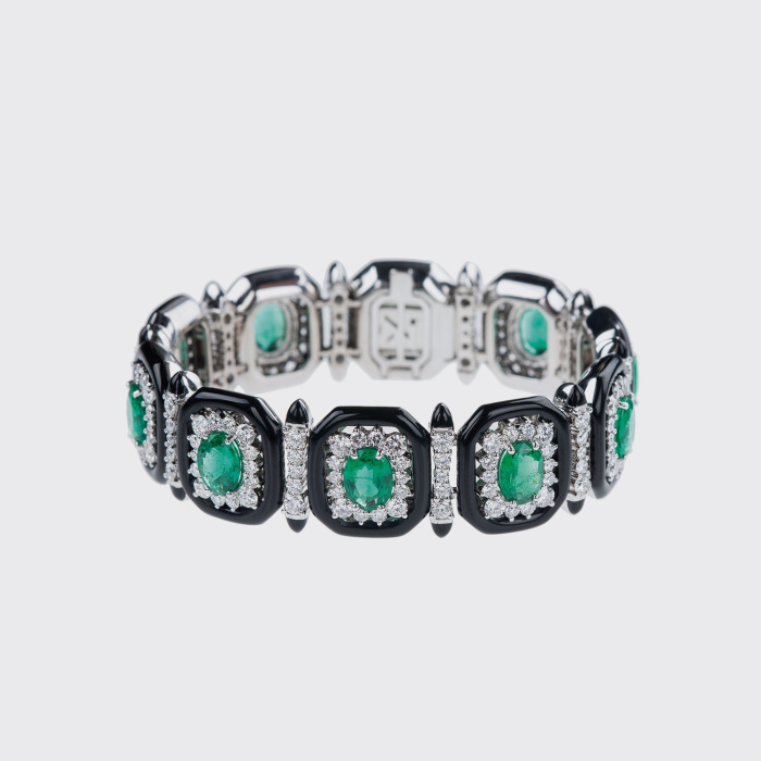 White gold tennis bracelet with emeralds, white diamonds and black enamel