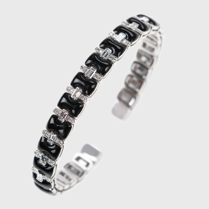 White gold bangle bracelet with white diamonds and black enamel