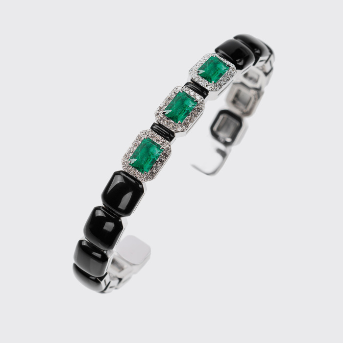 White gold bangle bracelet with emeralds, white diamonds and black enamel
