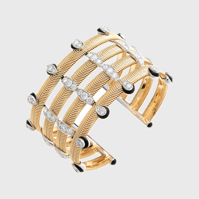 Yellow gold chain cuff bracelet with round white diamonds and black enamel