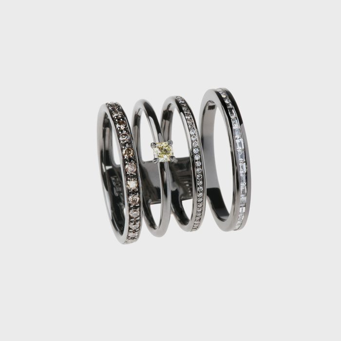 Black gold ring with brown diamonds, white diamonds, white diamond baguettes and yellow diamond