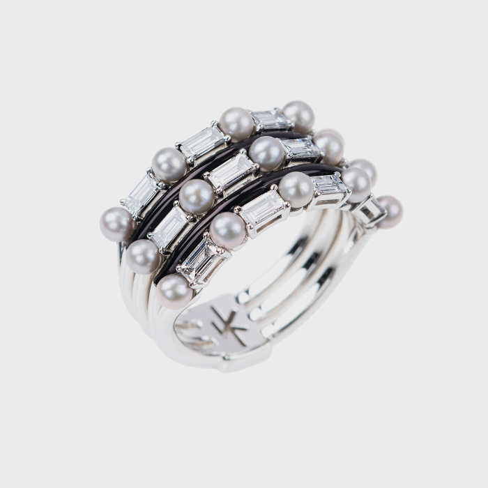 White gold ring with white diamonds, silver pearls and black enamel