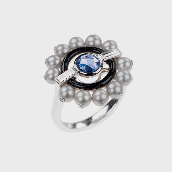 White gold ring with white diamonds, blue sapphire, silver pearls and black enamel
