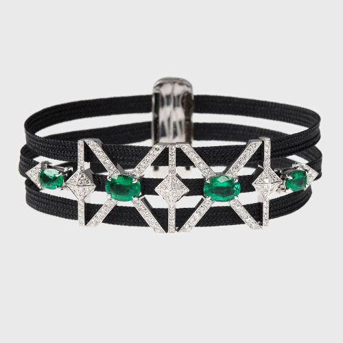 White gold triple cord bracelet with oval emeralds, white diamonds and black enamel