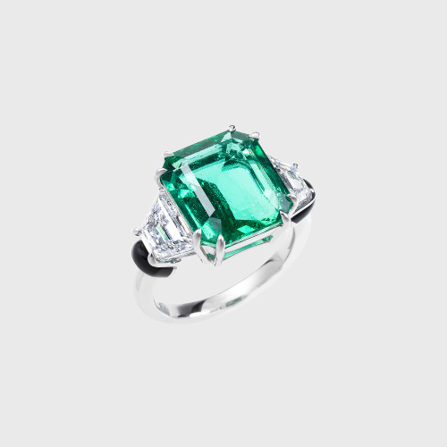 White gold ring with asscher cut emerald, trapeze white diamonds and black enamel