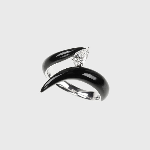 White gold ring with pear shape white diamond and black enamel