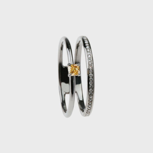 Black gold ring with white diamonds and yellow diamond