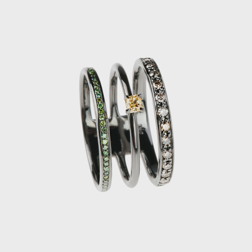 Black gold ring with brown diamonds, green diamonds and yellow diamond
