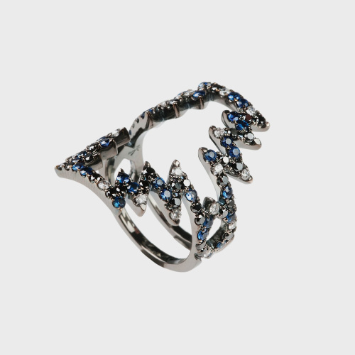 Black gold ring with white diamonds, black diamonds and blue sapphires